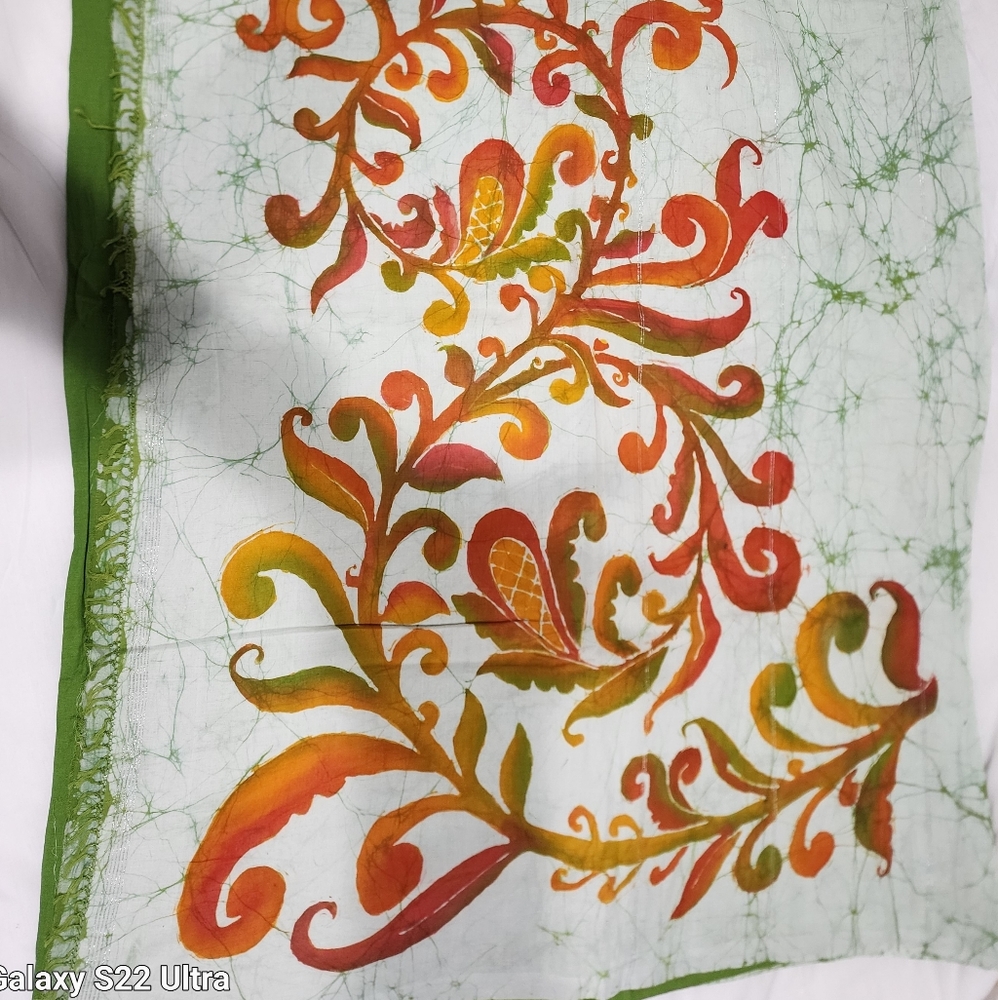 Handwoven batik dyed green, orange, white and silver thread cotton Saree